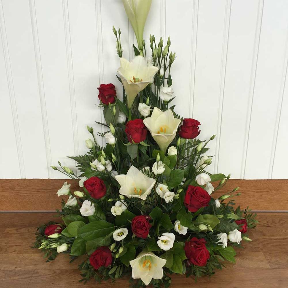 Röda rosor, vita liljor till begravning